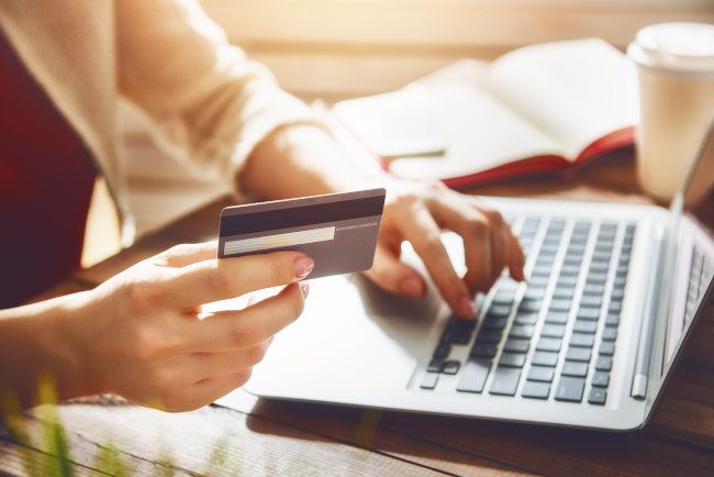 woman-with-laptop-and-credit-card